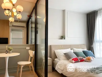 Modern studio apartment with a seamless blend of bedroom and kitchen space, featuring stylish lighting and a cozy ambiance, perfect for urban living.