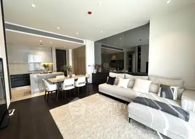 Luxurious open-plan living room with modern kitchen and elegant dining area