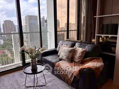 Luxurious living room with stunning city view and elegant decor in high-rise apartment.