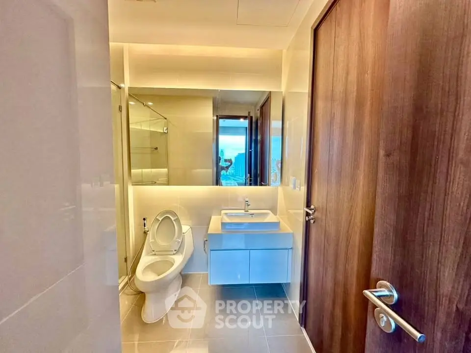 Modern bathroom with sleek fixtures and ocean view window
