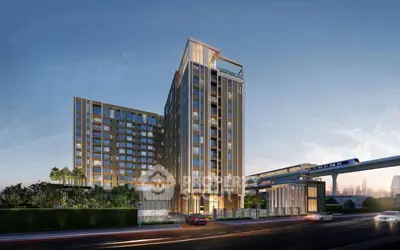 Modern high-rise building with sleek design near urban transit line