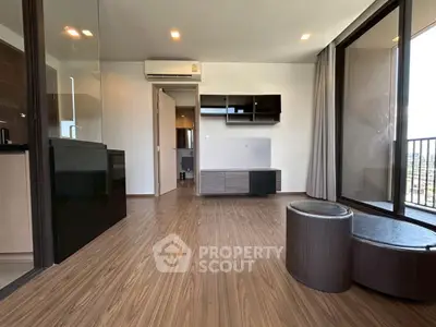 Modern living room with wooden flooring and balcony view