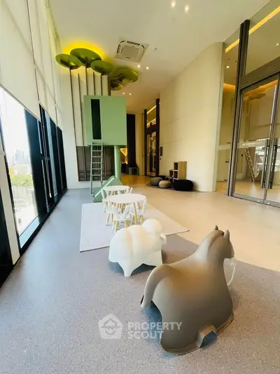 Spacious modern living room with high ceilings and playful decor in luxury apartment.