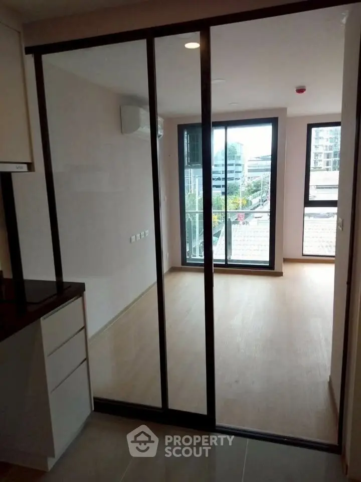 Modern apartment with sliding glass doors and balcony view