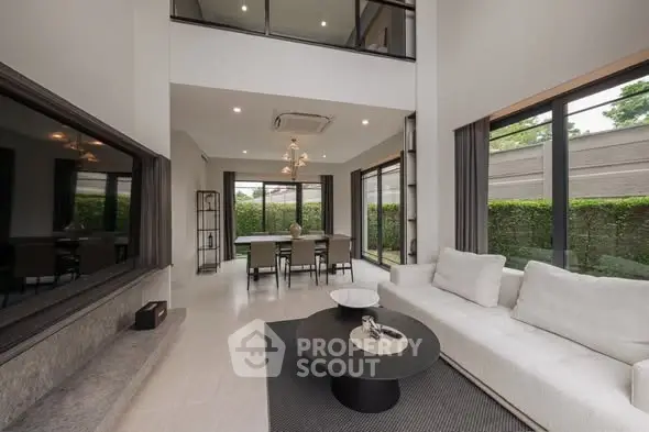 Luxurious modern living room with high ceilings and elegant decor