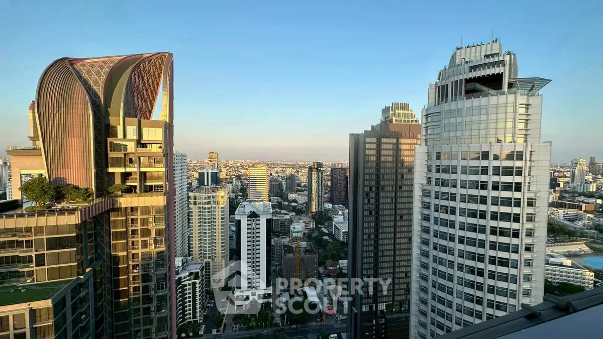 Stunning cityscape view from a high-rise building showcasing modern architecture and urban skyline.