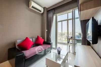 Modern living room with balcony view, featuring sleek furniture and air conditioning.