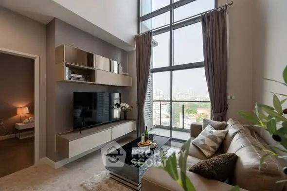 Luxurious living room with floor-to-ceiling windows and modern decor