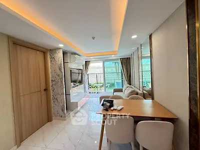 Modern living room with elegant marble accents and cozy seating area