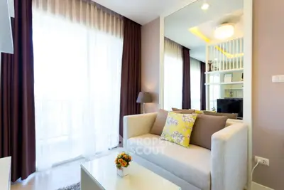 Bright and cozy living room with modern decor and large windows.