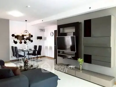 Modern living room with sleek TV unit and stylish dining area