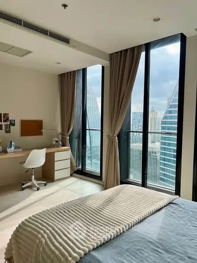 Luxurious bedroom with stunning city view and modern decor