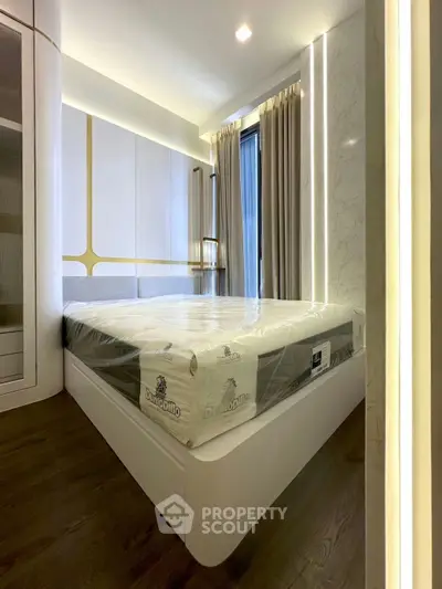 Modern bedroom with sleek design and large window for natural light