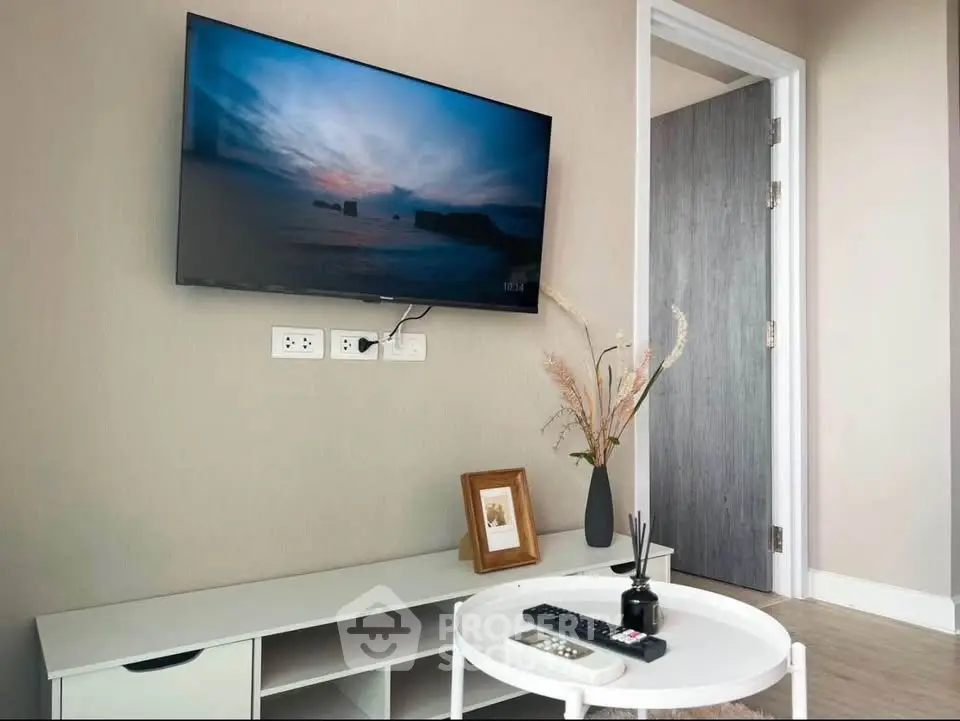 Modern living room with wall-mounted TV and stylish decor