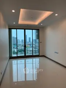 Spacious modern living room with city view and large windows