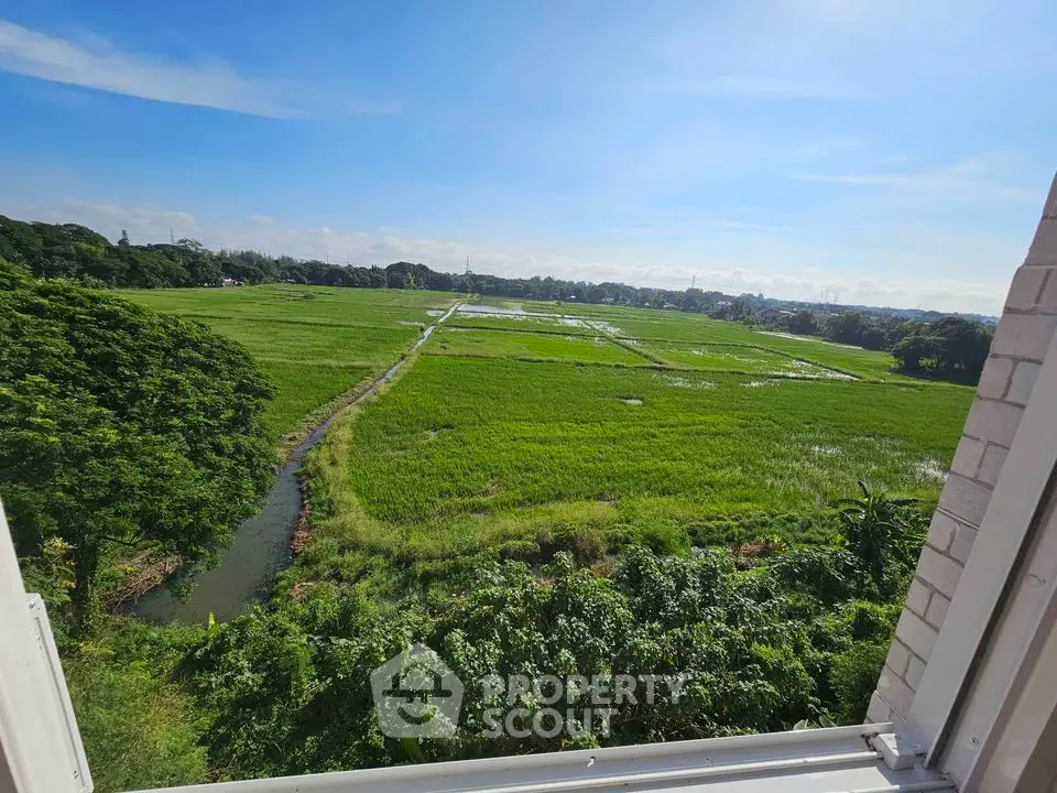 Stunning panoramic view of lush green fields from a high vantage point, perfect for nature lovers.