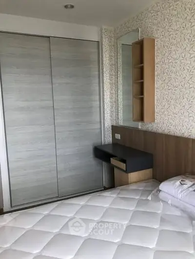 Modern bedroom with sleek wardrobe and stylish decor