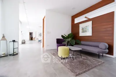 Stylish modern living room with elegant furniture and art decor