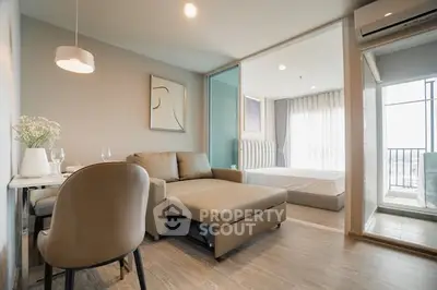 Modern apartment interior with cozy living room and bedroom, featuring stylish decor and natural light.