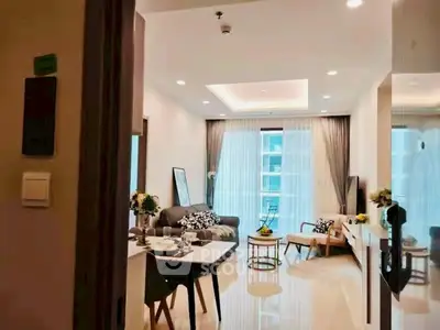 Modern living room with elegant decor and large windows in a stylish apartment.