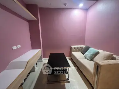 Cozy living room with modern sofa and sleek coffee table in stylish apartment.