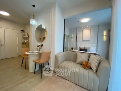 Stylish studio apartment with modern decor and cozy seating area