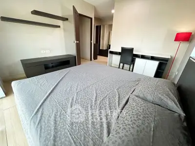 Spacious bedroom with modern furniture and stylish decor, perfect for comfortable living.