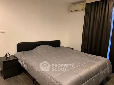Cozy bedroom with modern decor and air conditioning, perfect for restful nights.