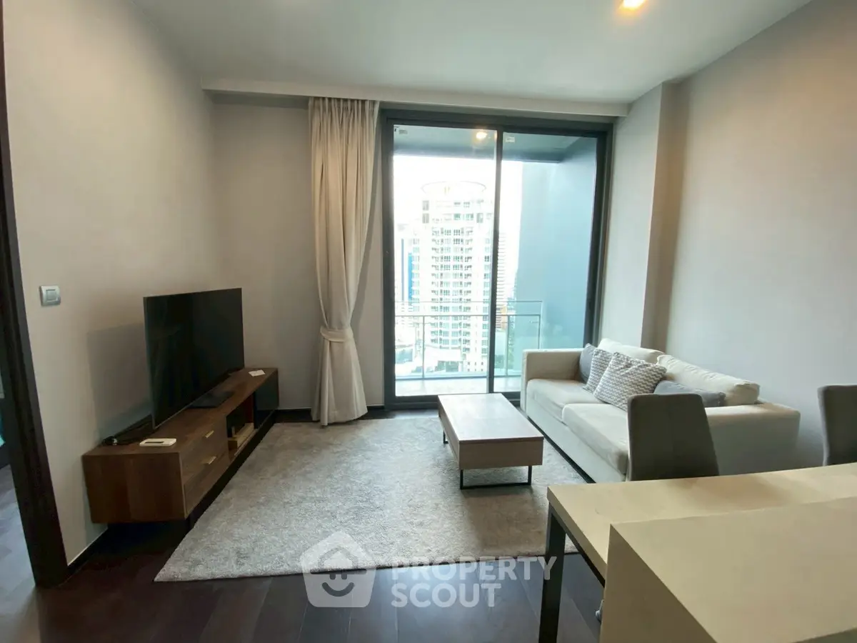 Modern living room with balcony view in high-rise apartment