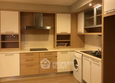 Modern kitchen with integrated appliances and sleek cabinetry