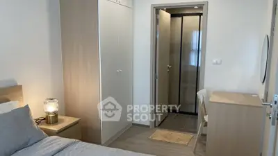 Cozy bedroom with ensuite bathroom and modern furnishings