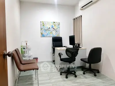 Modern study room with minimalist decor and air conditioning, perfect for productivity and comfort.