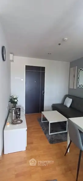 Modern living room with stylish furniture and wooden flooring