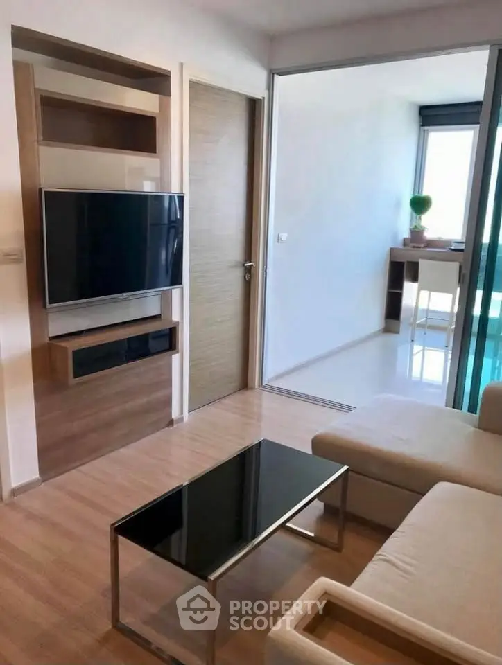 Modern living room with sleek TV setup and stylish furniture
