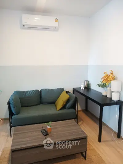 Modern living room with stylish furniture and air conditioning