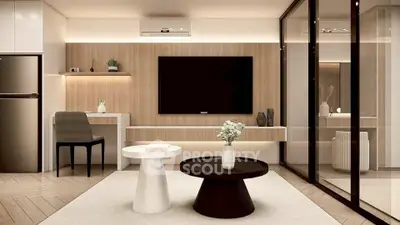 Modern living room with sleek furniture and large TV, featuring a stylish open layout.