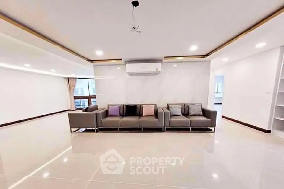 Spacious modern living room with sleek design and ample natural light