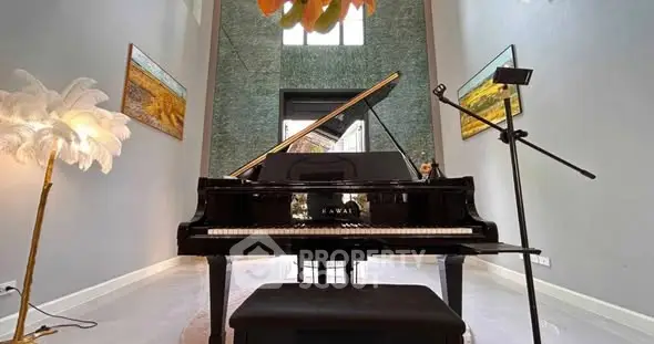 Luxurious living room with grand piano and elegant decor