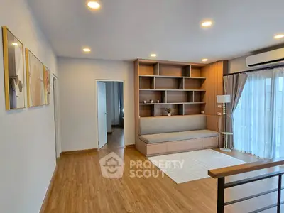 Spacious living room with modern decor and wooden flooring