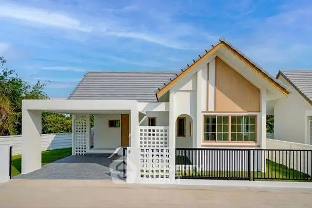 Charming modern house with sleek design and spacious driveway in a serene neighborhood.