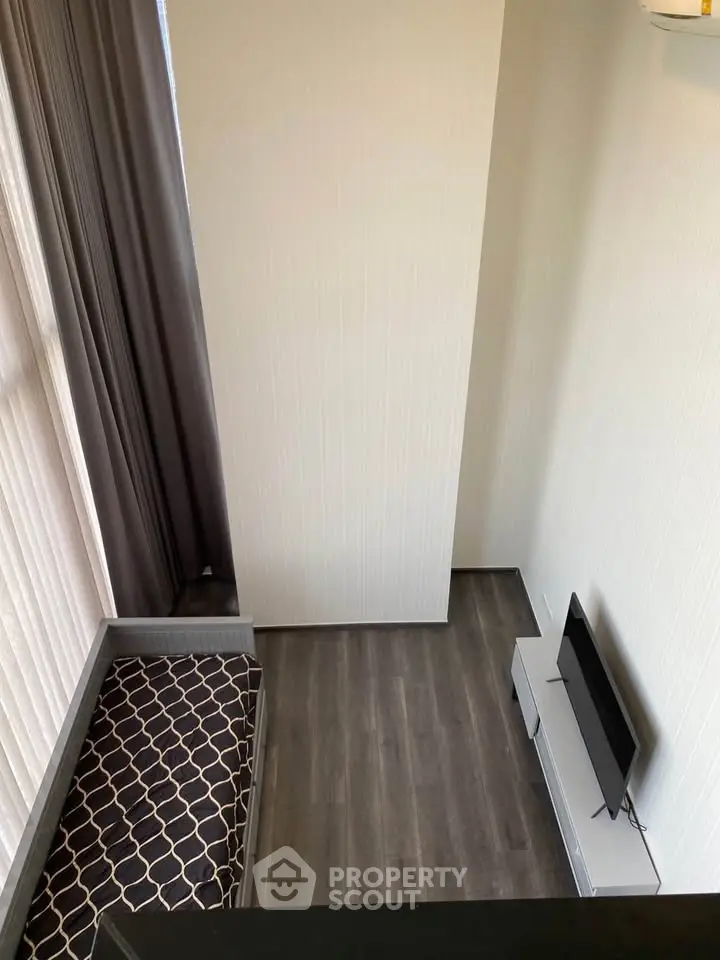 Modern minimalist living room with sleek flooring and stylish TV setup