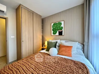 Cozy bedroom with modern decor and warm lighting