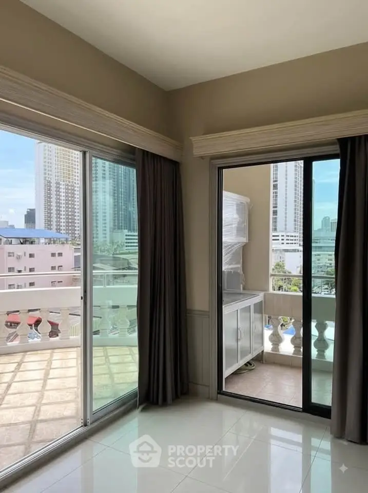Spacious corner unit with large balcony and city view, perfect for urban living.