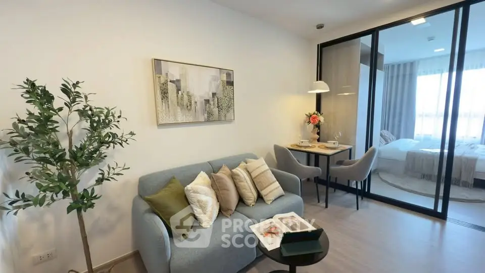 Modern living room with cozy seating and elegant decor in a stylish apartment.