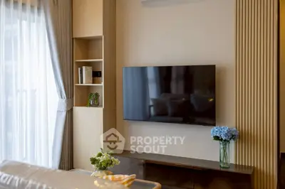 Modern living room with wall-mounted TV and elegant decor