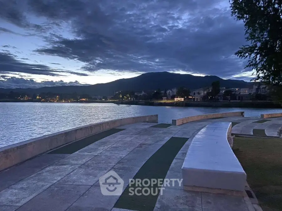 Stunning lakeside view with serene ambiance and mountain backdrop at dusk.