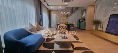 Stylish modern living room with elegant decor and open dining area