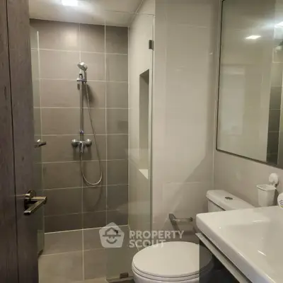 Modern bathroom with glass shower and sleek fixtures