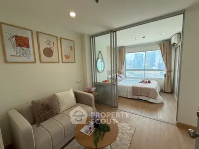 Chic modern apartment with cozy living room and bright bedroom, perfect urban retreat.
