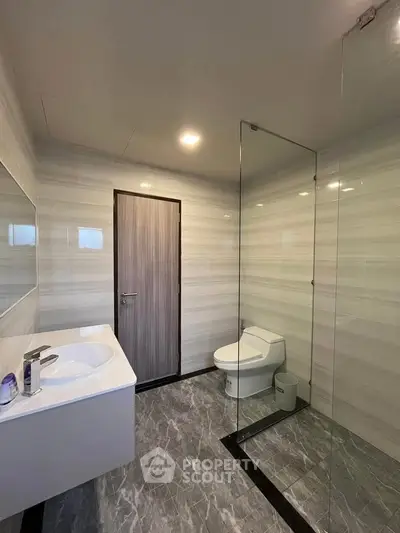 Modern bathroom with sleek design and glass shower enclosure